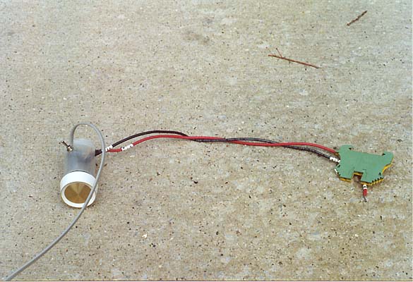 Dimmer circuit in 35mm film can. Toggle switch at rear adds white.